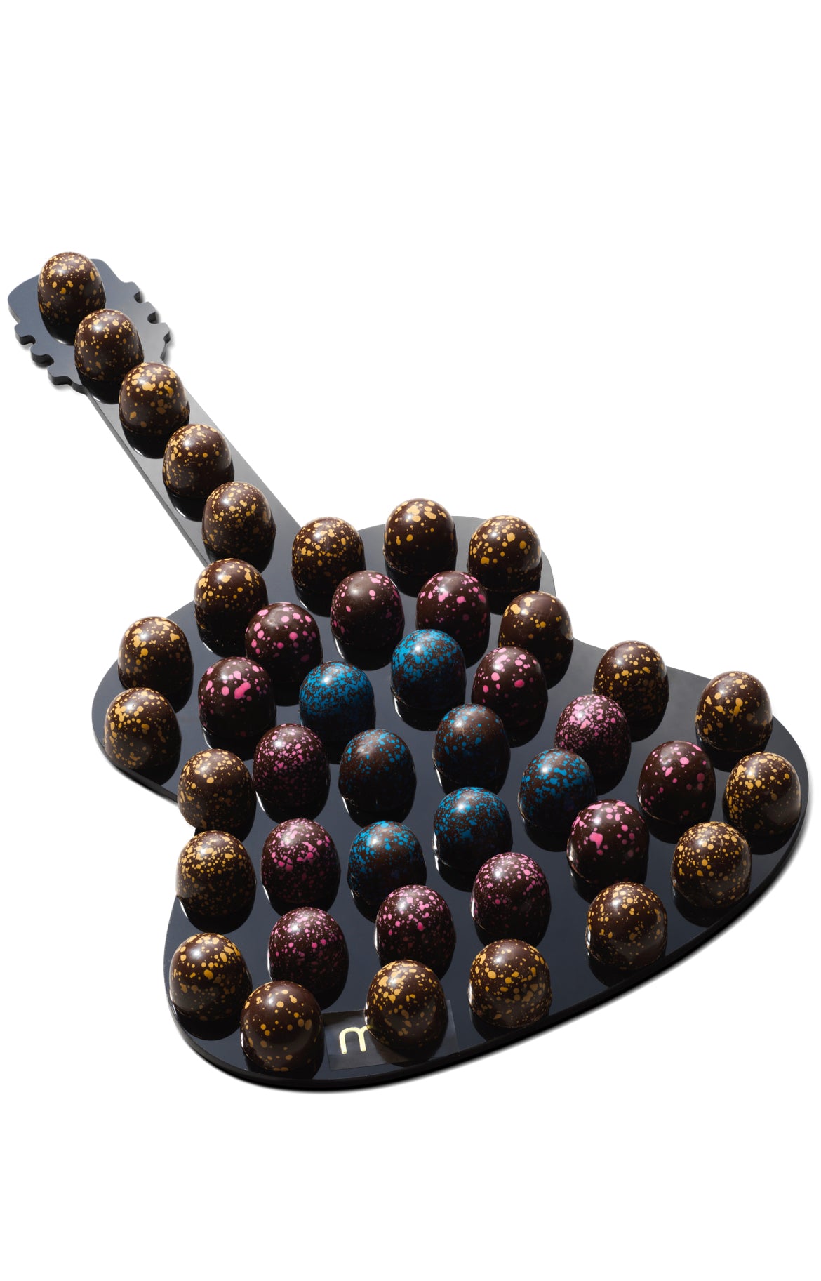 Chocolate Balls on Acrylic Violin